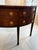English Mahogany Demiluned Sideboard with Lion’s Head Brass Hardware, circa 1810 A handsome English Regency mahogany...