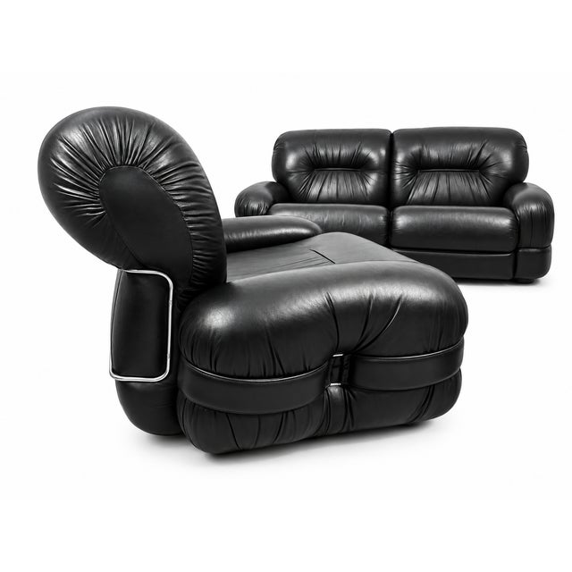 This set, featuring a three-seater sofa and two armchairs, features large, comfortable seats by Adriano Piazzesi, created...