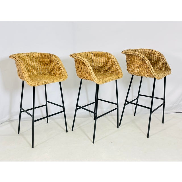 Elevate your kitchen or bar area with this stylish set of three contemporary barstools, featuring handwoven water hyacinth...