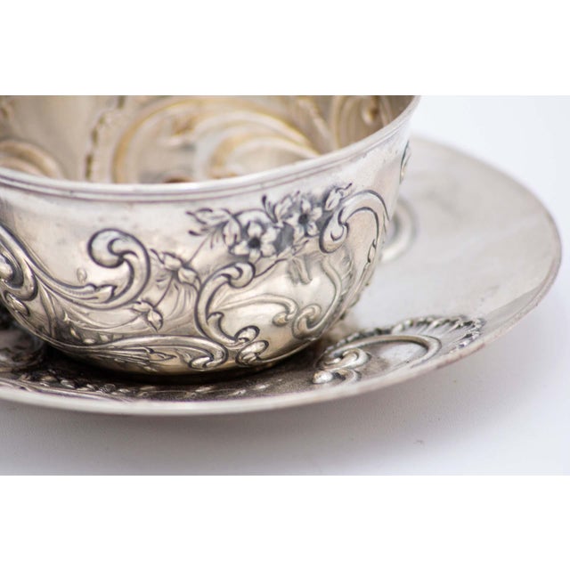 Cup and Saucer in Embossed Silver with Floral Motifs and Garlands, Set of 2, in Very Good conditions. Designed 1890 to...
