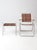 Vintage mid-century folding patio chair and side table set showcasing the playful modernist design and practical elegance...