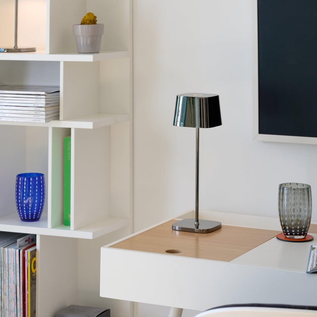 Battery-operated and rechargeable portable table lamp. The lamp features dimming touch control and dimmer memory function,...