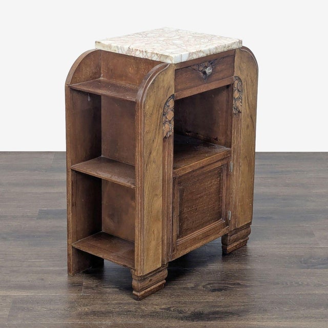 Carved cabinet and drawer with side shelving. Dimensions (in): 24W x 12D x 30H.