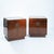 A refined pair of walnut-veneered cabinets by Baker Furniture, USA, a distinguished American manufacturer celebrated for...