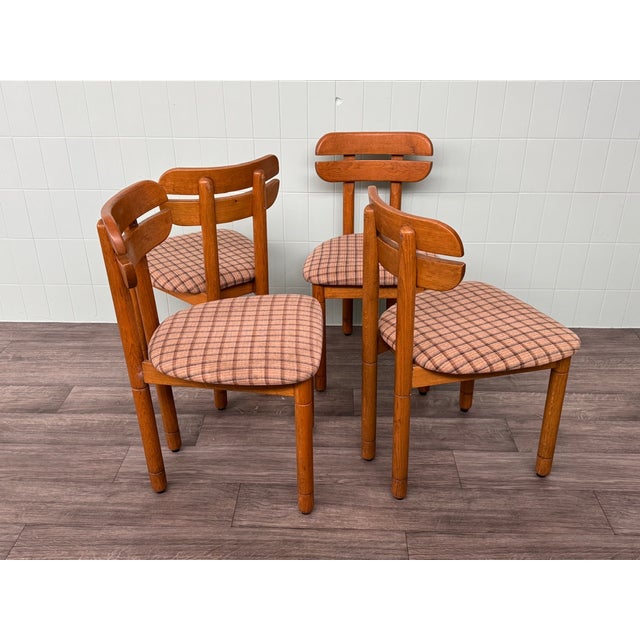 Set of 4 Italian-made chairs made of oak. Oak wood frame and seats covered in fabric. The chair model has a curved back.