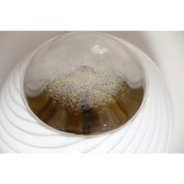 A very particular, rare and quite big flush mount light or ceiling lamp, but can be used also as wall sconce, with shiny...