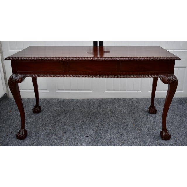 Vintage (1980's) Writing Table Desk/Console has a Chippendale Style. The Wood is Mahogany. The Desk has a Rope Edge, Ball...