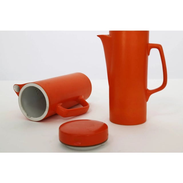 Porcelain Pitchers by Largardo Tackett, Marked on underside.