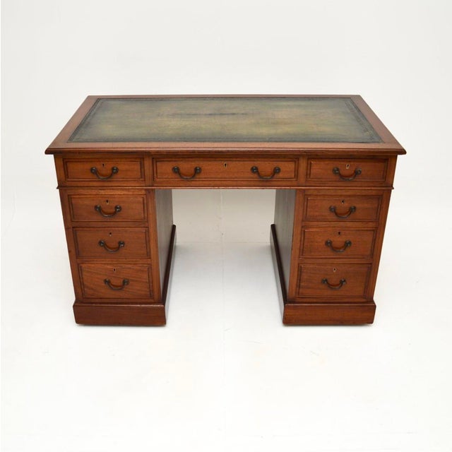 A smart and very useful antique Victorian leather top pedestal desk. This was made in England, it dates from the 1860-1880...