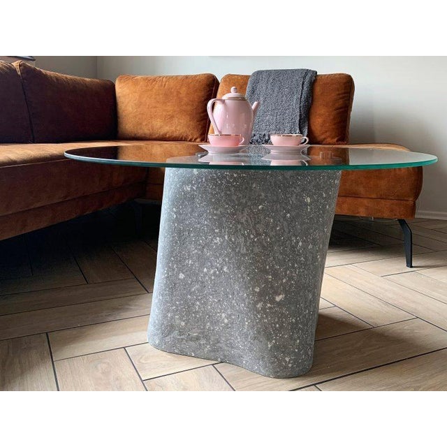 Plinth low coffee table with glass top by donatas zukauskas a sculptural bio cement coffee table with an architectural...