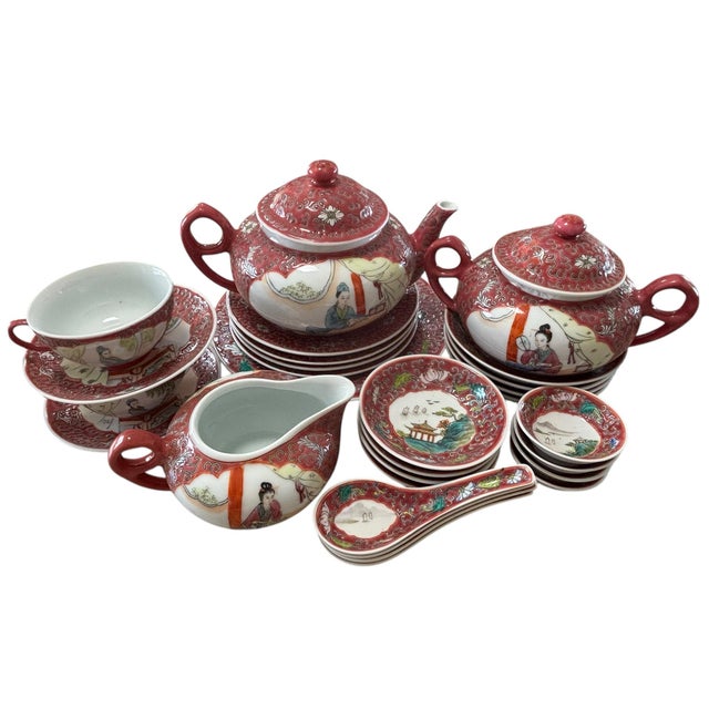 Service for four Mun Shou Longevity raspberry red porcelain luncheon/tea set, 28 pieces. This set is hand painted in the...