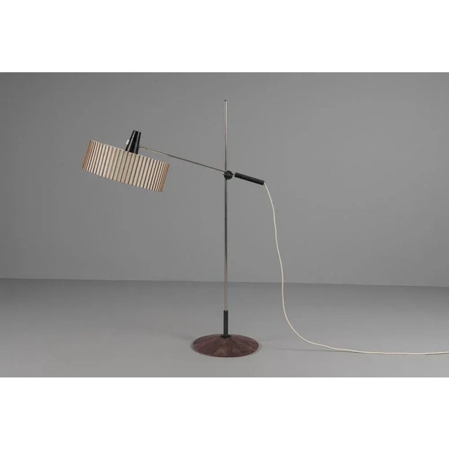 Very rare mid-century modern floor lamp with teak veneer and very large lampshade. made by temde. Made in switzerland....