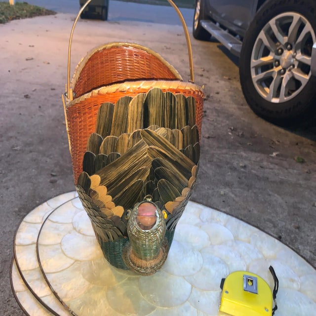 Double headed geese basket in pretty good shape. There is some minor damage to one side as can be seen in the pictures....