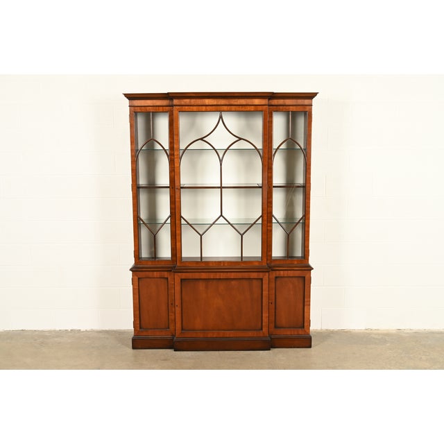 A gorgeous Georgian or Chippendale style lighted breakfront bookcase, dining cabinet, or display cabinet By Kittinger USA,...