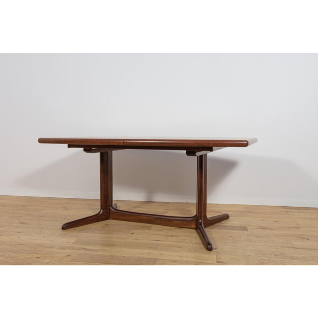 This extending dining table was manufactured in Denmark during the 1960s. The model is an excellent example of...