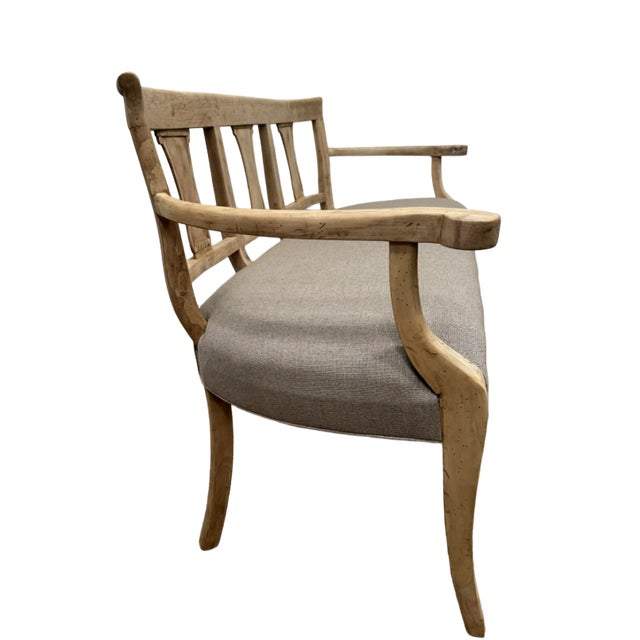 Beautiful carved wood and upholstered bench that has been stripped and bleached to create an elegant yet casual feel....