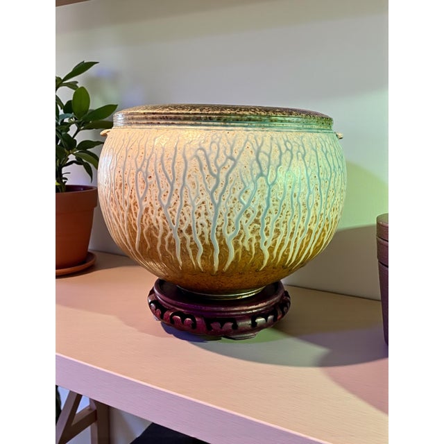 Hand-thrown and signed by noted American ceramicist Richard Aerni, this rounded vessel features his signature ash-glaze...