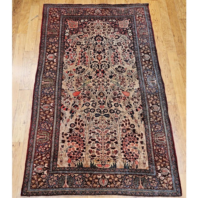 "An exquisite vintage Persian Kashan area rug featuring the revered “Tree of Life” design, masterfully hand woven with...