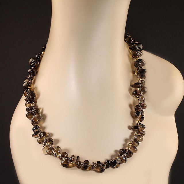 Elevate your jewelry collection with this exquisite 22-inch smoky quartz nugget necklace, a true statement piece that...