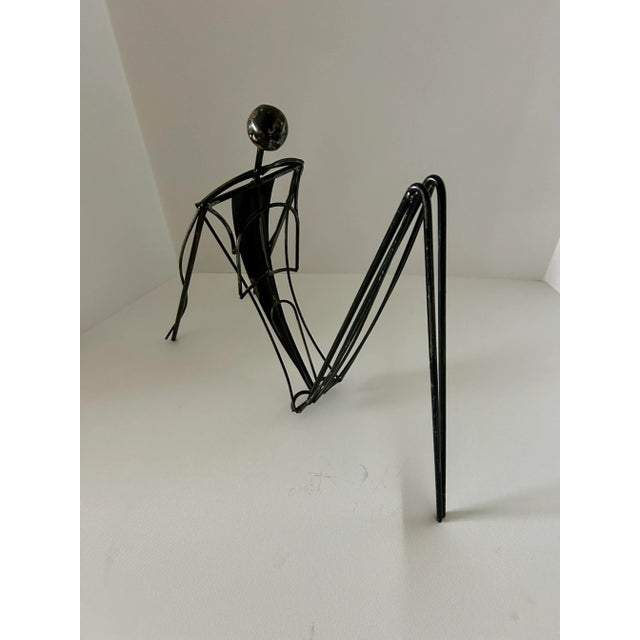 Abstract Sculpture by Curtis Jere, signed and dated 1992. Sculpture is an abstract silhouette of a man reclining. One of...