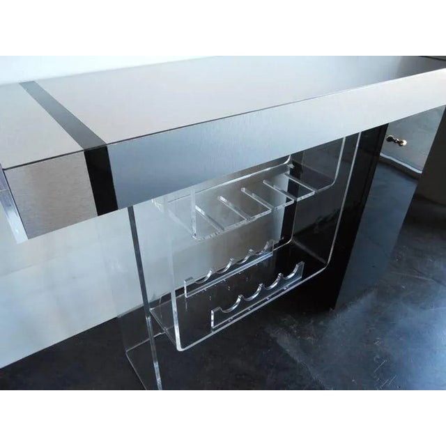 Modernist bar set (bar and 2 Lucite stools) in the style of Charles Hollis Jones Under the platform there are lights and...