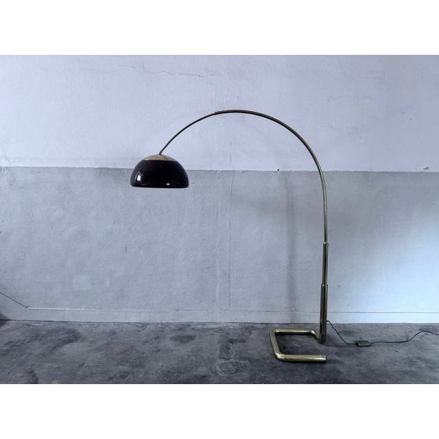 1970s arc lamp with gold-enameled metal frame and brown plastic lampshade. The lamp is in very good condition, both...