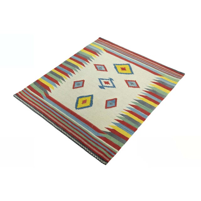 An expressive piece of traditional weaving art with a modern character. This hand-woven kilim from the Fars region...