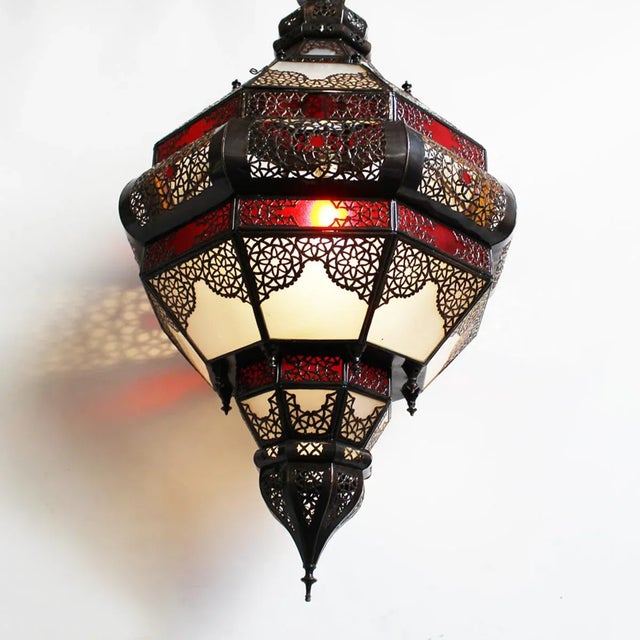 Gorgeous vintage hand cut metal pendant with red and frosted white frosted glass panels. Includes 3' chain and black...