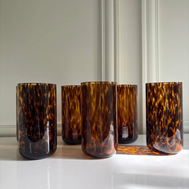 Lovely set of six tortoise shell print highball glasses/tumblers in shades of amber and brown. Made in Italy. Brand new,...