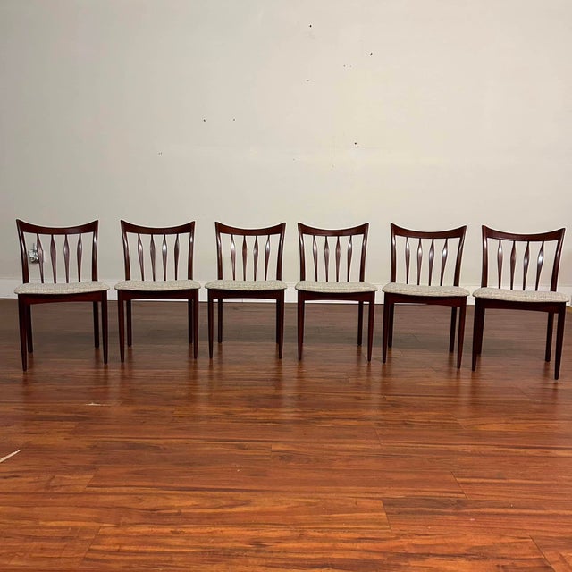 Set of six vintage slat back dining chairs made in England by Greaves & Thomas circa late 1970's. These chairs are quite...