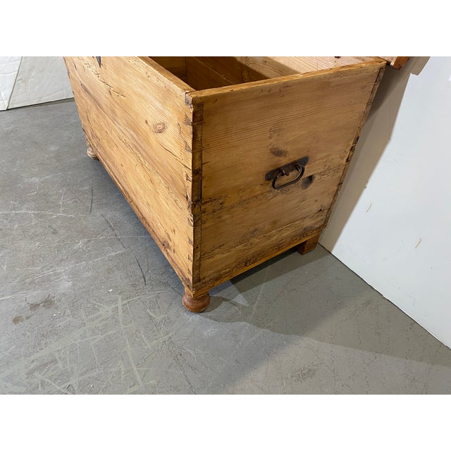 19th-Century German pine chest. Dovetail is on each corner and, iron pulls on each side.