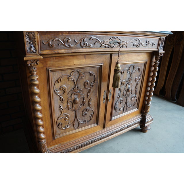 Antique marble top buffet with incredible hand carved details. This piece has a perfectly aged patina, character and charm...