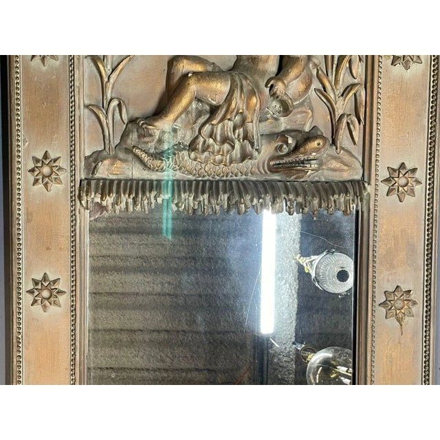 19th Century Wall, Console or Pier Cherub Mirror Wall or console mirror having a clear antique center panel flanked by a...