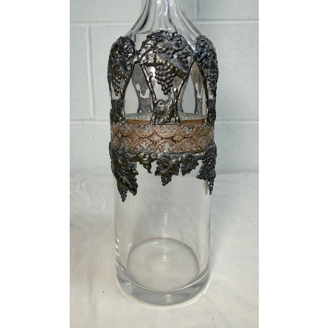Up for sale is a very nice quality antique silverplate and bronze overl colorless glass decanter. The bottle is made of...