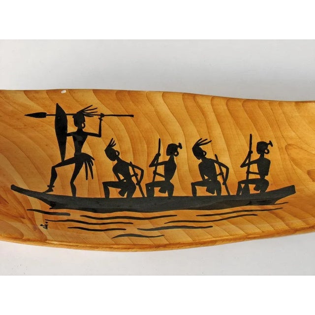 Hand-painted ceramic imitation olive wood (faux bois) with typical African motifs of the period in black, hand-signed on...