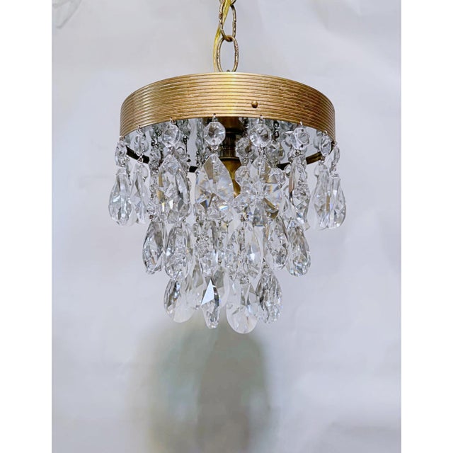 This exceptional vintage chandelier is an absolute goldmine of radiant warmth, capturing the high-glamour, curated look of...
