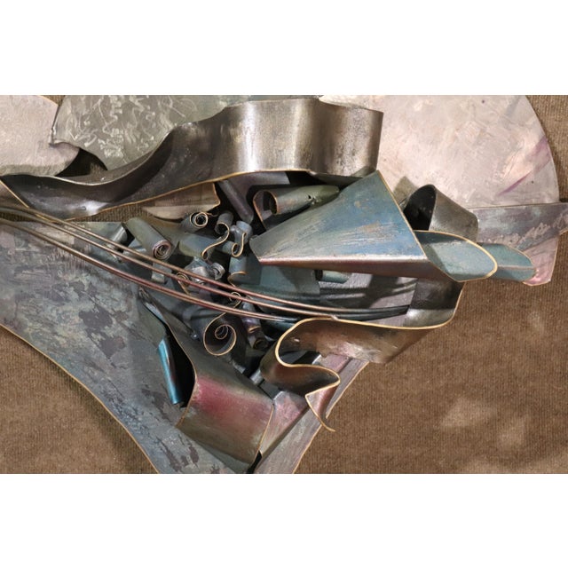 Artist signed wall art with mixed metal. Beautifully designed with curled metal, etched metal, copper tubes.