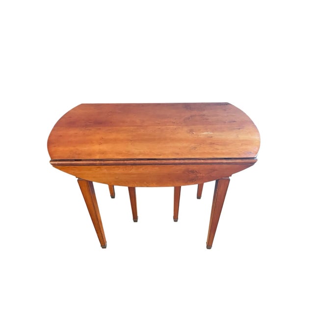 This exquisite antique French-style dining table is a beautiful example of timeless elegance and sophisticated...