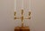 Made in Sweden. This exquisite three-arm candelabra, crafted from solid brass, is a design masterpiece produced by Gusum...