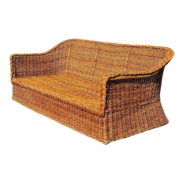 A beautifully woven wicker sofa often attributed to Bielecky Brothers, Wicker Works, or Michael Taylor- three names...