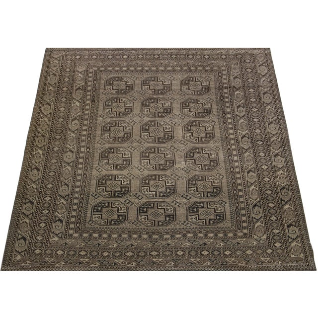 Beautiful antique Turkmen hand-knotted wool rug with a gray color field. This Persian piece has a gorgeous Gul pattern...