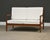A mid century modern solid teak loveseat sofa. Well made professionally refinished. New white cushions. Seat height is...