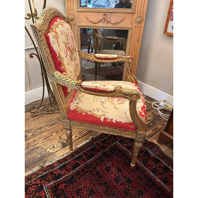 Show stopper opulent reproduction Louis XV giltwood arm chair upholstered in mouthwatering tapestry. Arm height 27” TS