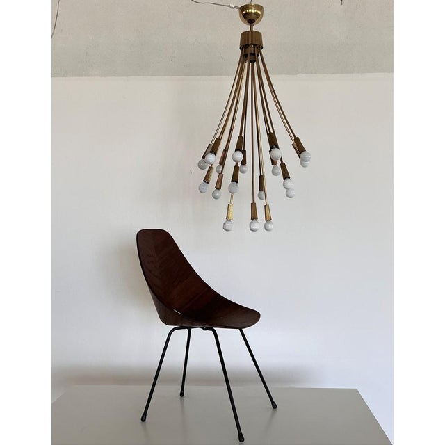 Rare, beautiful and unusual brass chandelier. Made in Italy in the 60s - 70s. The chandelier has a total of 18 arms for 18...