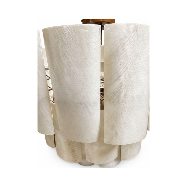 The Made Goods Marjorie Resin Chandeliers, offered as a pair, feature a dramatic tiered silhouette composed of overlapping...