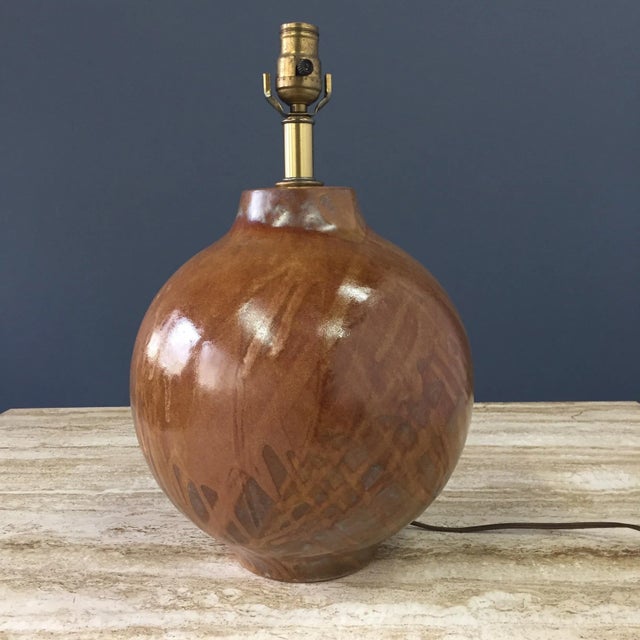 Quintessential Mid-Century ceramic lamp this lamp has a wonderful glaze in browns and light blues thrown by the artists at...