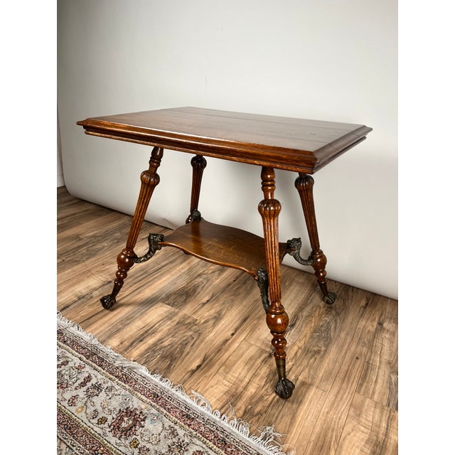 This attractive antique Victorian lamp stand dates to the late 19th century and is crafted from beautifully grained oak, a...