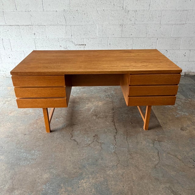 This large Danish executive desk is truly impressive, both in size as well as design. While it appears simple and straight...