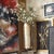 This metal vase is tall and oversized which makes it a perfect floor vase. The main body of the vase is cylindrical. The...