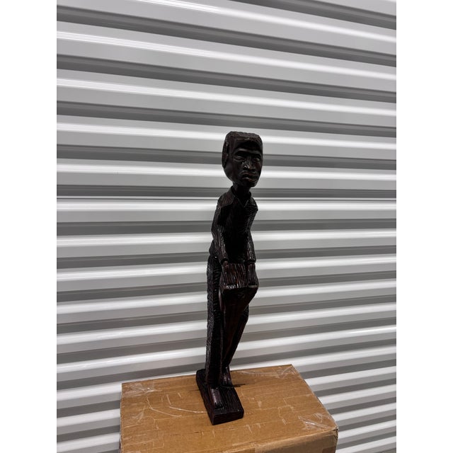 Hand-carved folk art sculptureFeatures a standing male figure with a drumCommon mid-to-late 20th-century decorative...